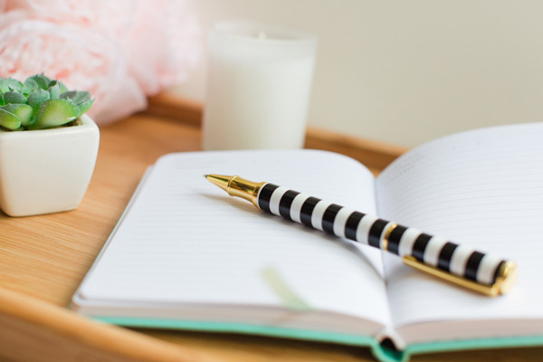 Notebook with pen for planning meals and shopping lists